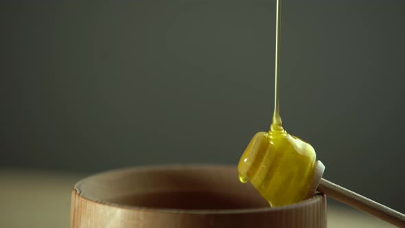 Thick Honey Dripping From the Spoon Close Up alt