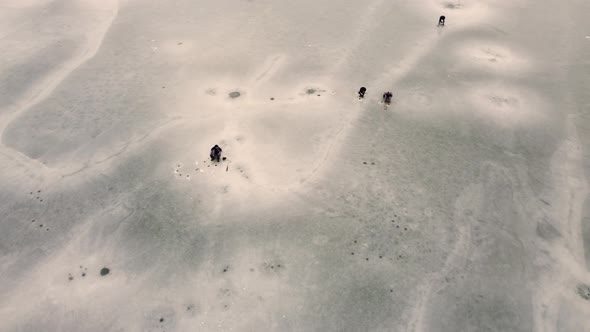 Flying Around A Fisherman In Frozen Lake