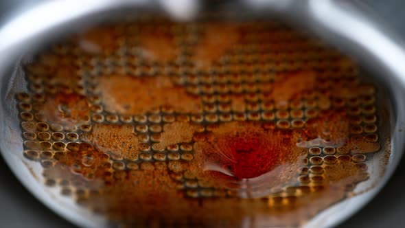 Super Slow Motion Macro Shot of Dripping Fresh Espresso Coffee From Lever Machine at 1000 Fps alt