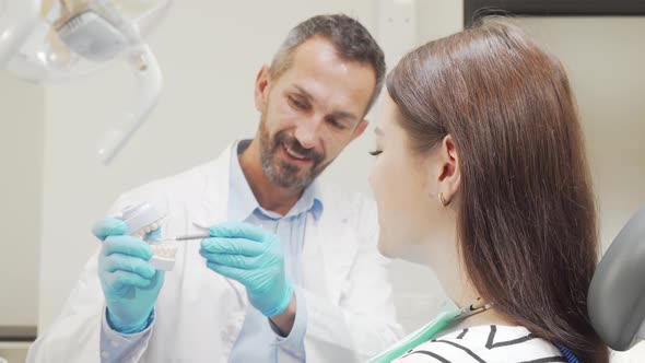 Attractive Woman Smiling To the Camera During Appointment with the Dentist alt