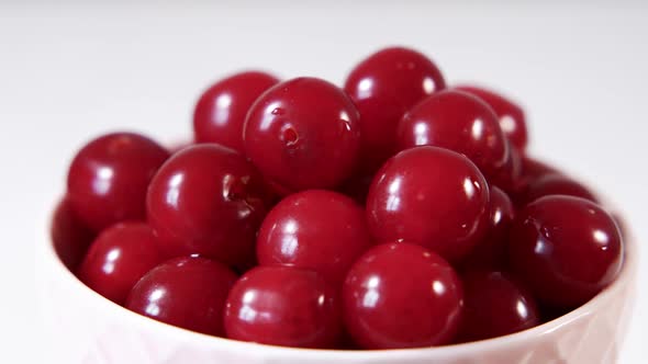Bowl of Cherries Rotating on a Light Background
