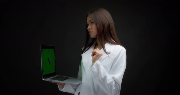 Asian Woman Send Email on Laptop with Chroma Key Isolated on Black Background