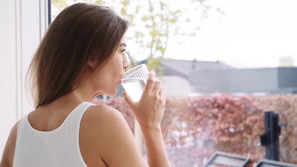 Woman Enjoying Glass of Water