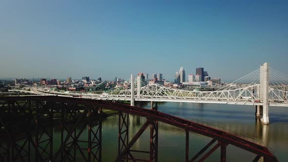 4k Aerial View of Drone Flying Over Bridges Outside Louisville with Skyline in The Distance alt