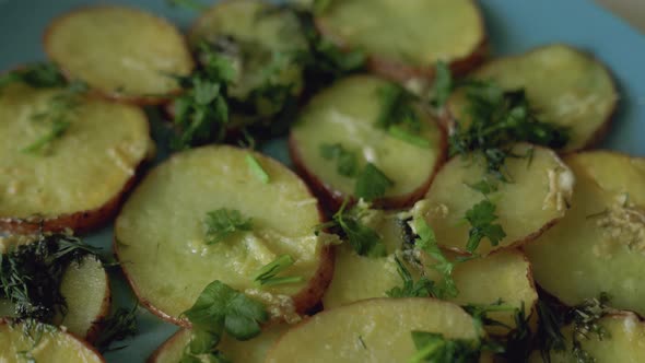 Fried potatoes lie beautifully on a blue plate