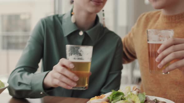 Man and Woman Drinking Beer in Pub alt