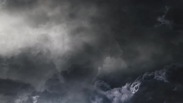 POV of  thunderstorm timelapse with a flash in the dark cloudy sky. alt