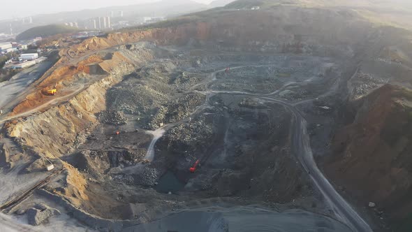 Panorama of a Rock Quarry Dump Trucks Quarrying Mining Overburden alt