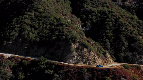 Mt. Baldy mountain road with a blue Tesla Model S. alt