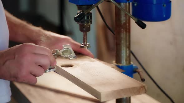Joiner is Installing Furniture Loop in Wooden Detail Working in His Workshop Closeup of Hands alt