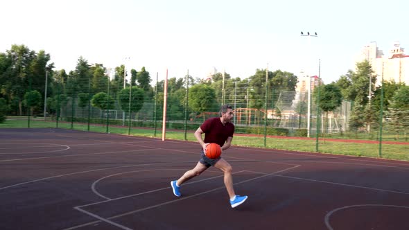 Mature Man Playing Basketball Throw the Ball Into the Basket Sport Game Slow Motion alt