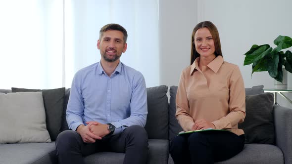 Portrait Smiling Woman Psychologist and Happy Man Patient Sitting on Couch alt