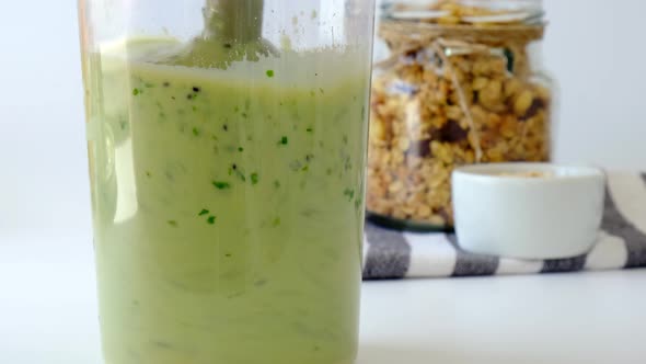 Woman Cooking Healthy Smoothie Add Green Apple Kiwi Spinach Blended in Blender Green Smoothies alt