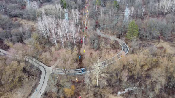 Aerial view on colored cableway cabins in spring