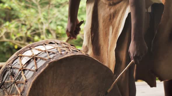 Zulu Tribesman Hitting on a Drum During Traditional Ritual alt