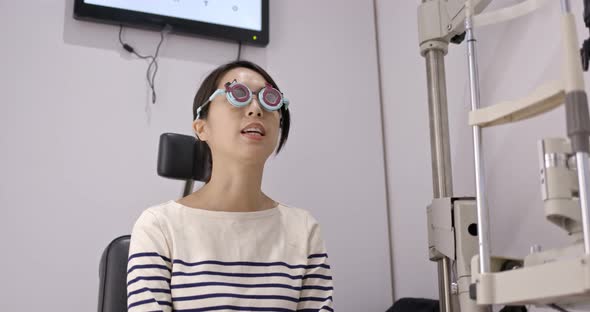 Woman visit the eye clinic undergo eye exam