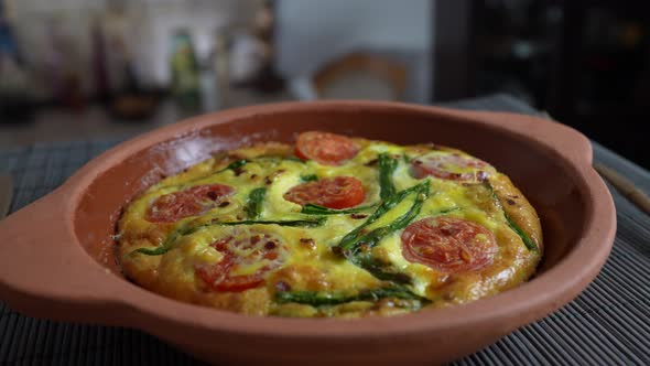 Vegetable frittata with egg, tomato, pepper, onion, cheese and green wild garlic alt