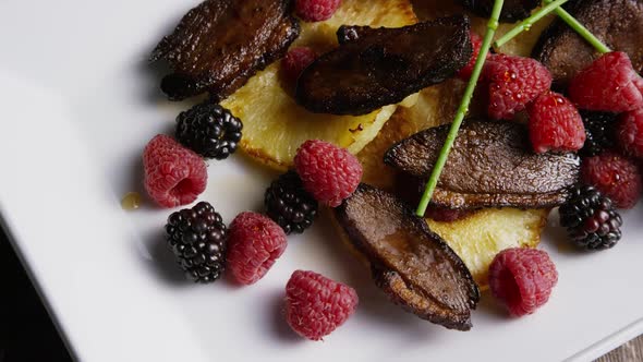 Rotating - smoked duck bacon with grilled pineapple, raspberries, blackberries and honey alt