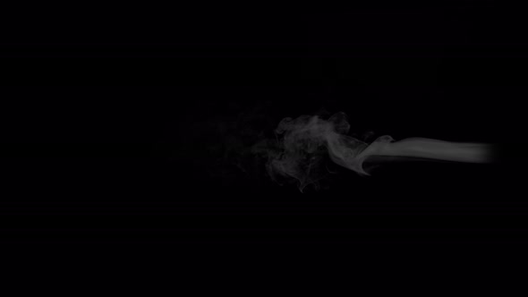 Super Slow Motion Shot of Rising Smoke Isolated on Black Background at 1000 Fps alt