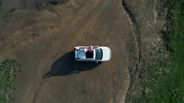 Couple Traveler on Suv Car Enjoying View of Carpathian Mountains alt