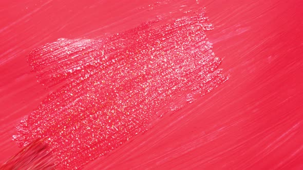 Close Up View on the Artist Covering a Bright Pink or Raspberry Surface with a Glossy Finish Coat