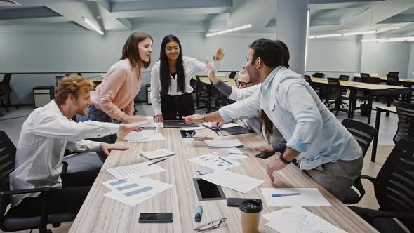 Diverse Colleagues Putting Their Hands on Top of Each Other Smiling Being Satisfied with Productive alt