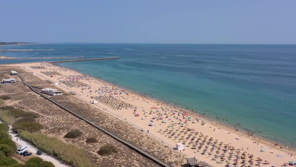 Aerial Video Beautiful Portuguese Beaches Near the Tourist Town Vilamoura Falesia with a View of the alt