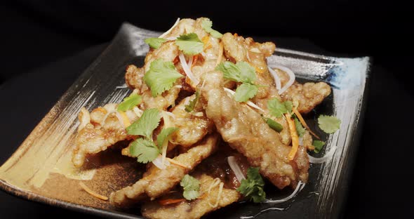 Baked Chicken In Caramel Sauce Is Laid On A Plate alt