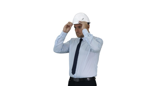 Businessman Putting Hardhat Helmet on Safety on White Background alt