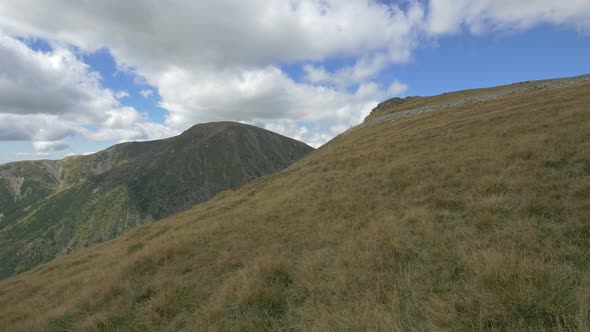 Hills and mountains on a cloudy day alt