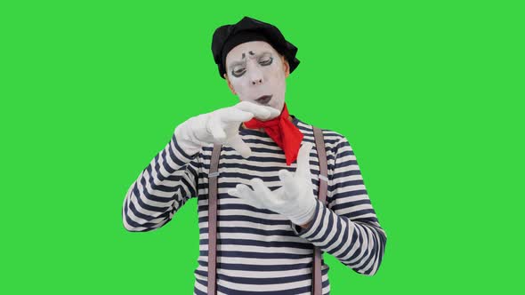 Mime Artist Holding Imaginary Ball on a Green Screen Chroma Key alt