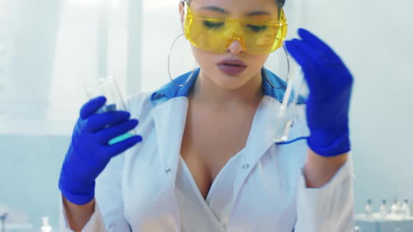 Beautiful Woman Pharmacist Take Some Chemical alt