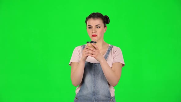 Girl Drinks Unpalatable Coffee and Is Disgusted on Green Screen alt