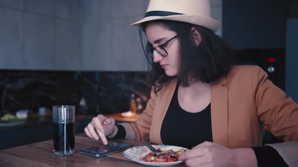 Teen Girl is Having Dinner at Home and Chatting with Friends on the Phone Cinematic Shot