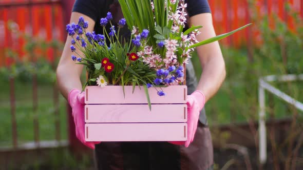 Woman with a box of flowers