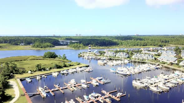 Aerial view of marina with lighthouse in South Carolina. alt