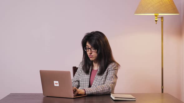 Tired Atractive Woman Working on Laptop Computer and Thinking Solving Problem at Home Office
