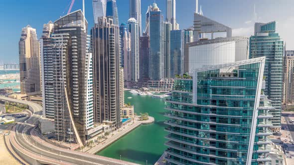 Aerial View of Dubai Marina Residential and Office Skyscrapers with Waterfront Timelapse alt