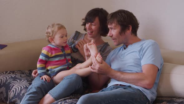 Caucasian family having fun in living room at home alt