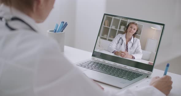 Online Consulting of Two Female Therapists, Talking By Video Call, Using Laptop with Web Camera and alt