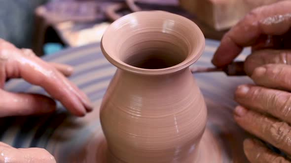 Potter at Work Teaching Young Student alt