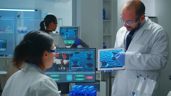 Team of Industrial Scientists Innovating New Vaccine Using Tablet alt