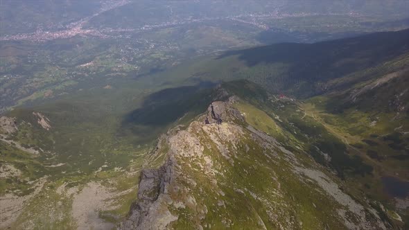 Aerial wide shot of the mountain ridge of Pietrosu Rodnei, Rodnei Mountains National Park, Romania alt