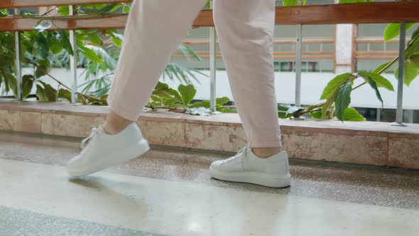 Female Legs In White Sneakers Dancing