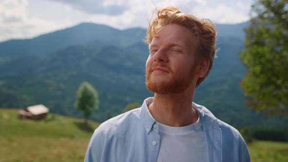 Young Man Bearded Face Looking Around Enjoying Mountains Landscape Close Up alt
