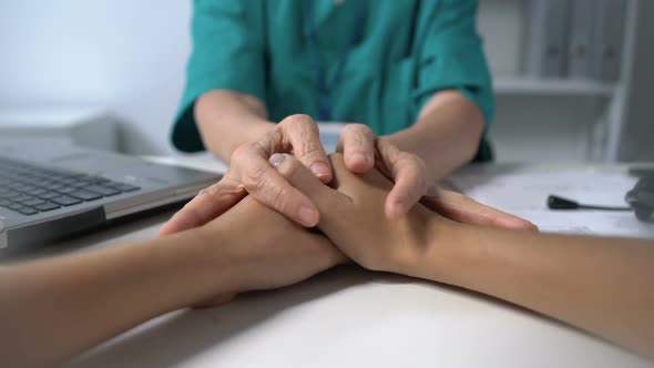 Doctor Touching Female Patients Hands Comforting and Supporting, Healthcare, Pov