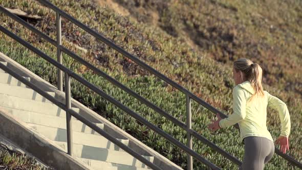 A woman running stairs alt