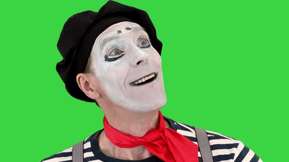 Mime in White Gloves Performs Something on a Green Screen Chroma Key alt