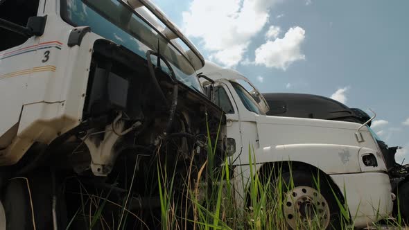 Close Up Shot of Elements Cabin Old Broken Cargo Truck in a Scrap Yard Near the City alt
