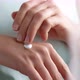 A woman applies a cosmetic hand skin care cream. - VideoHive Item for Sale